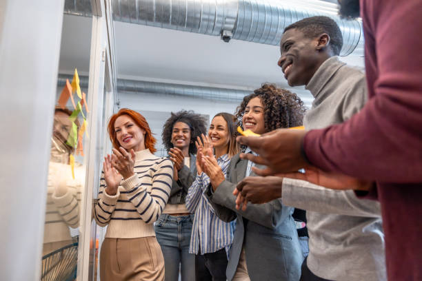 istock Colleagues applauding after a successful brainstorming process in a coworking 2177190829