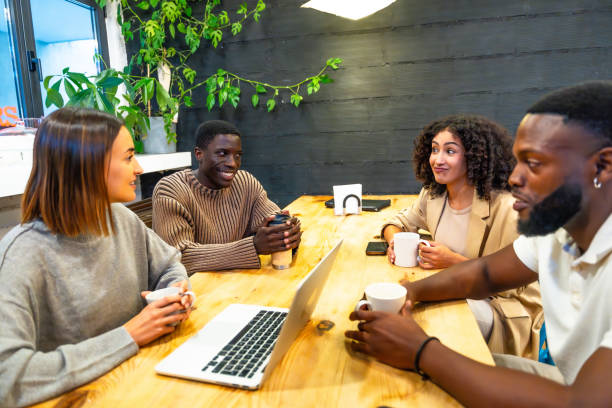 istock Coworkers talking during coffee break in the office 2177190957