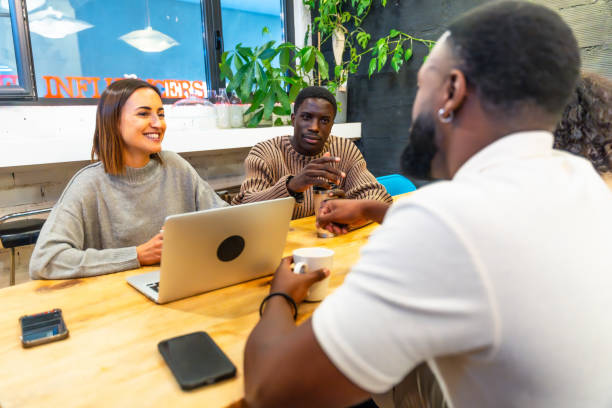 istock Diverse colleagues drinking coffee in a modern coworking space 2177190961