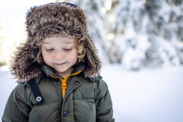 Portrait Of Cute Boy During Winter