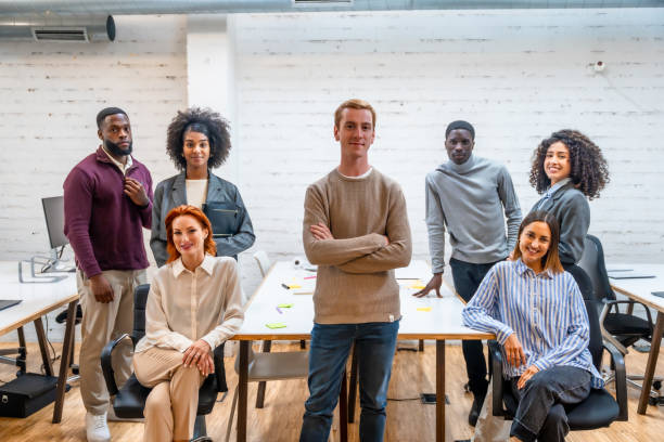 istock Confident man standing next to coworking colleagues 2177191302