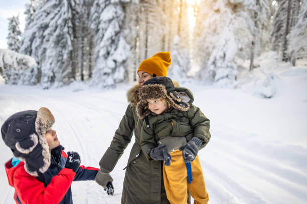 istock Mother and sons enjoying a winter day 2177192555