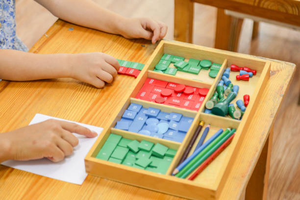istock Close-up of a child using wooden Montessori math tool 2177193292