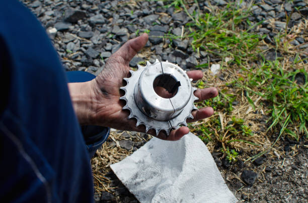 A child cleans the sprocket of his sports car.Preparing for the race. Sports car repair