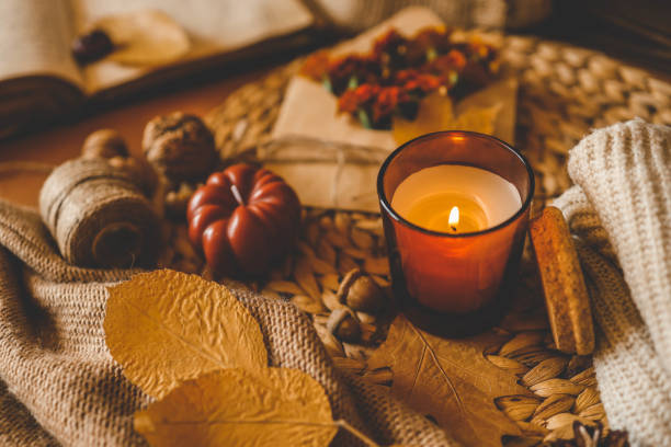istock Burning candle in a cozy warm homey autumn atmosphere 2177196928