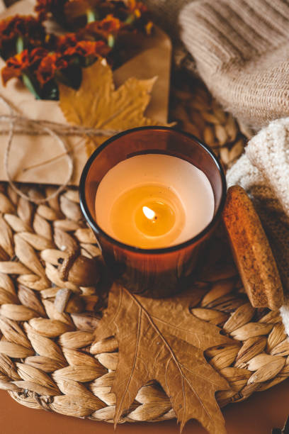 istock Burning candle in a cozy warm homey autumn atmosphere 2177196939