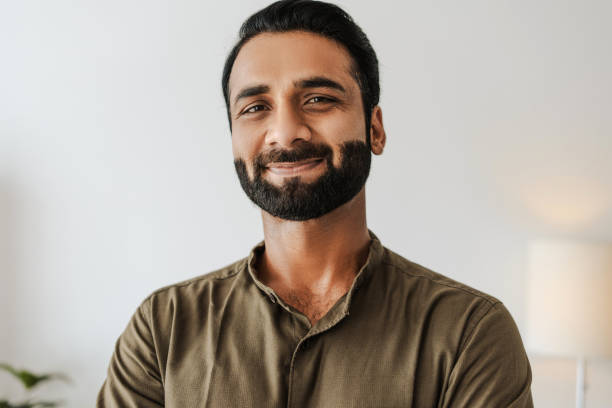 istock Confident, smiling indian male entrepreneur looking at camera standing on white background 2177197109