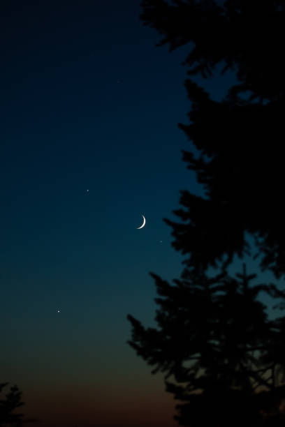 istock Crescent Moon, stars, planet conjunction and landscape scenery silhouettes. 2177197652