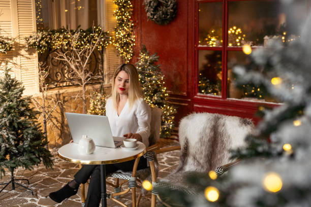 istock Woman with a laptop on Christmas holidays 2177199206