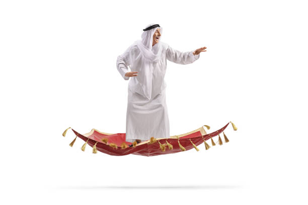 istock Arab man in a traditional robe flying on a magic carpet 2177200972