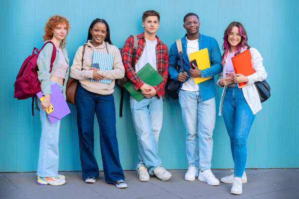 istock Five students having fun with mobile phones creating content on social media. 2177201609