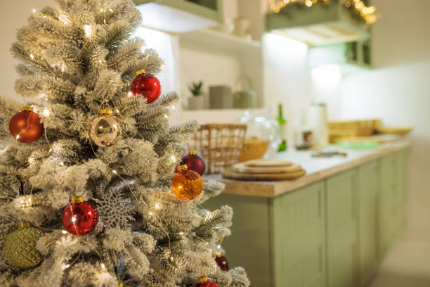 istock Beautifully decorated Christmas tree with red and gold ornaments, illuminated by warm white lights 2177202575