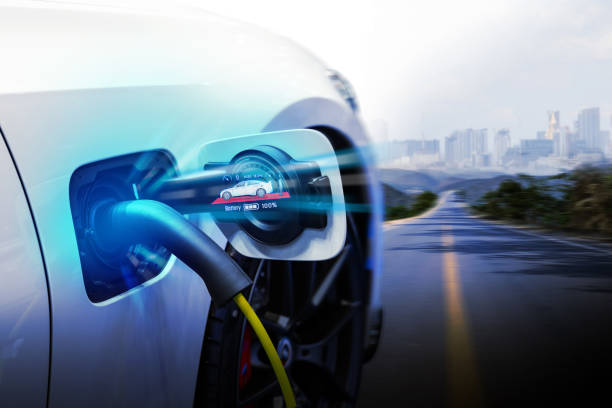 istock Power cable pump plug in charging power to electric vehicle EV car. 2177203634
