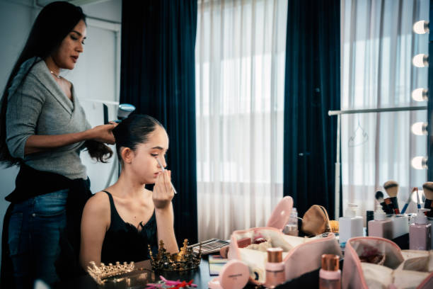 istock Makeup artist putting makeup on her young ballerina 2177213391