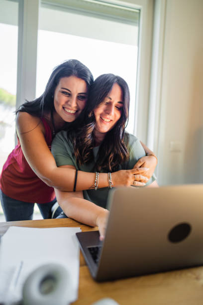 istock friends at home enjoying doing homework together 2177215111
