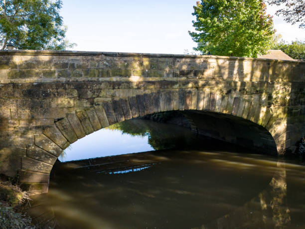 Bridge of the medieval village of Puebla de Sanabria reflected in the river Tera, Zamora, Castilla y León, Spain.