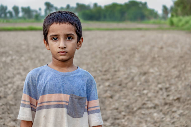 an Indian Boy in a Rural Landscape