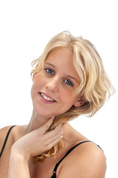 Portrait of a beautiful European blonde girl with braids. Smiling girl. Studio shot, isolated on white background.