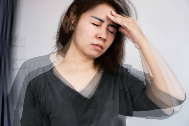 Asian woman suffering from Anemia feeling dizzy and vertigo , weakness
