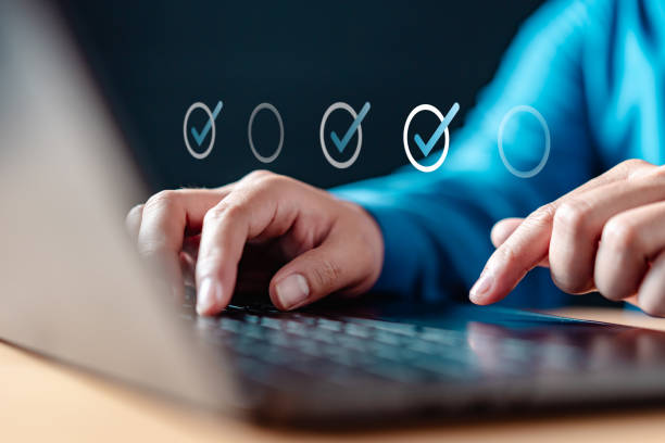 istock A person is typing on a laptop with a check mark on the screen. 2177225987