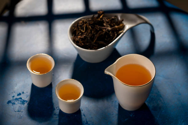 A retro style Chinese tea cup with a blue background