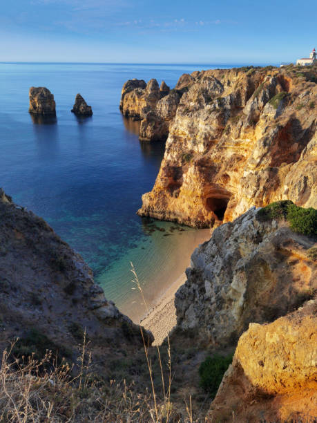 istock sunrise at Praia da Balanca with rocks and sun 2177228042