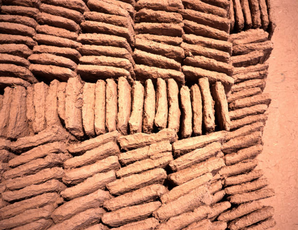 Detail of an exposed adobe brick wall.