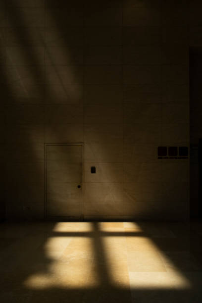 istock Light streamed in through the windows, creating a cross shape on the marble floor.       . 2177228397