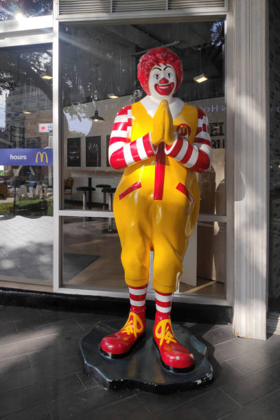 Pattaya, Thailand - September 16 2024: Ronald McDonald giving the traditional Thai greeting (wai) at the entrance of a McDonald's.