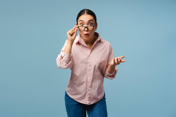 istock Shocked young Asian woman adjusting her glasses looking surprised 2177231754
