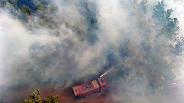 istock Fire Truck in Thick Smoke During Forest Fire 2177232734