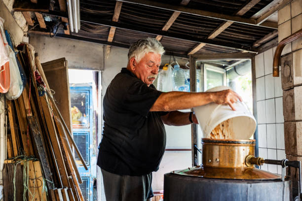 istock Elderly Man in Workshop with Distillery Equipment 2177232857