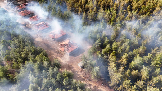 istock Smoke Surrounding Fire-Damaged Buildings in Forest 2177235936