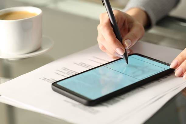 istock Woman hand signing online document with smart phone 2177236919