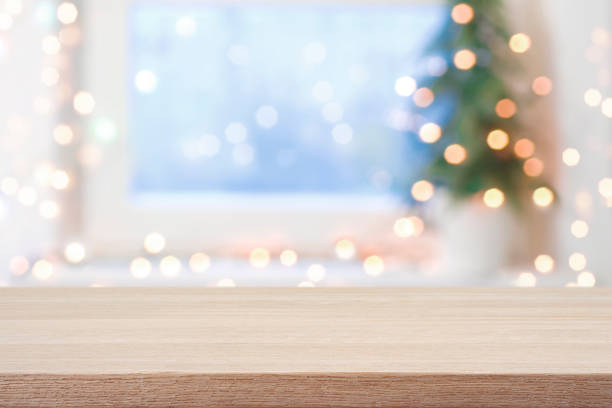 istock Empty table in front of blurred Christmas tree and decoration lights background 2177238671