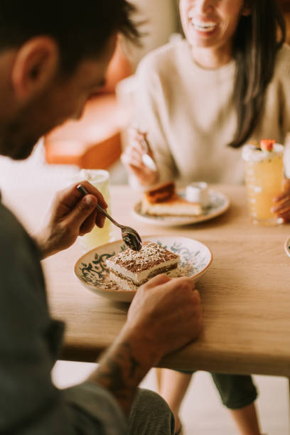 istock Enjoying dessert together in a cozy cafe while sharing laughter and delightful conversation on a sunny afternoon 2177238851