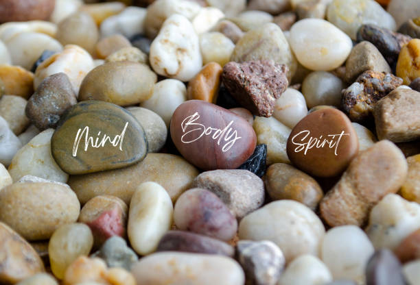 istock Mind, Body and Spirit text on beach stones. Wellness concept. 2177240077