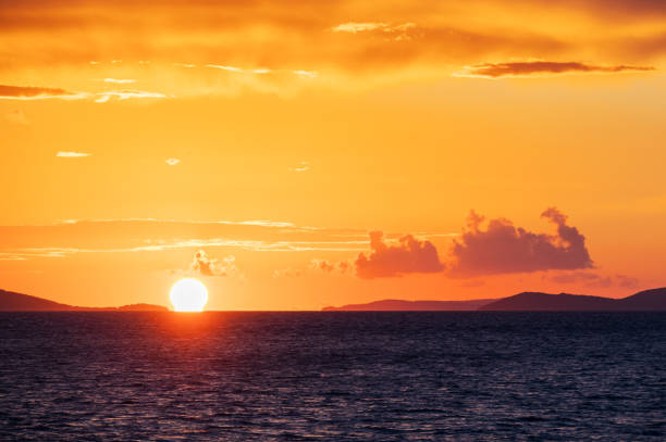 A beautiful orange sea sunset and the silhouette