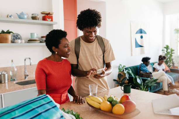 istock Happy family morning: Mother and son in kitchen preparing breakfast together 2177243895