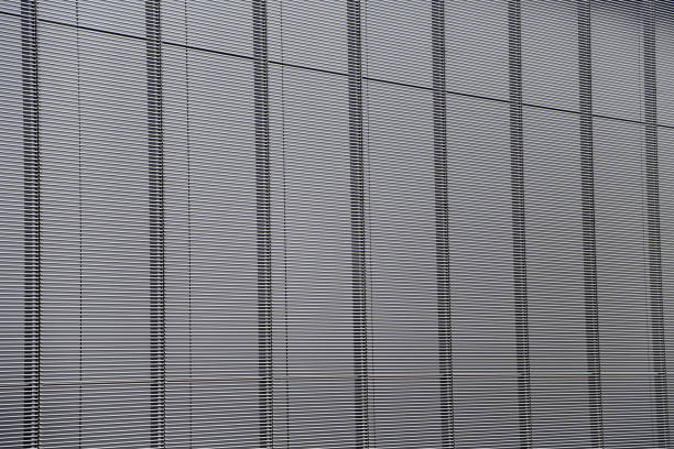 istock Striking interplay of light and shadow on modern architectural facade with sleek striped design in an urban environment during daylight 2177246257