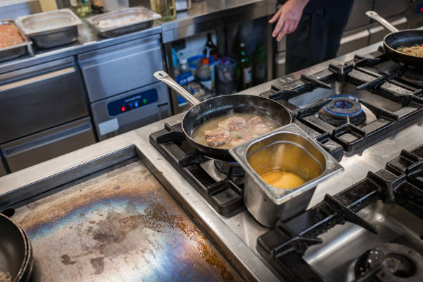 istock Professional Kitchen Scene with Chicken Cooking on Stove 2177247027