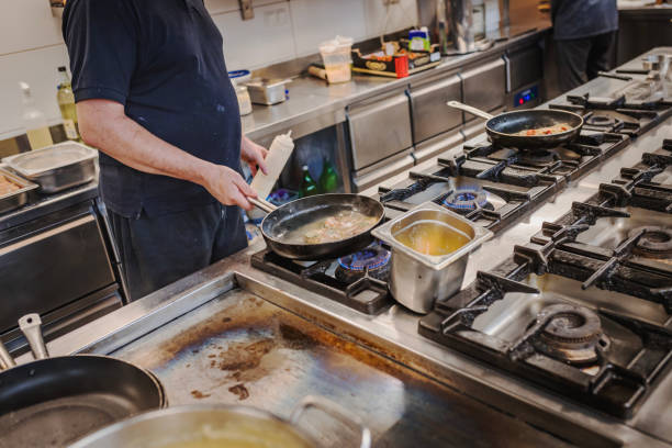 istock Chef Preparing Gourmet Dish in a Professional Kitchen 2177247447