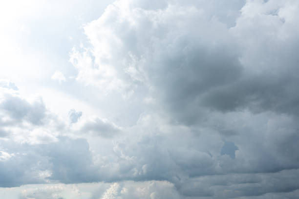 istock Fluffy white clouds drift across a clear blue sky, painting a beautiful summer day 2177249000