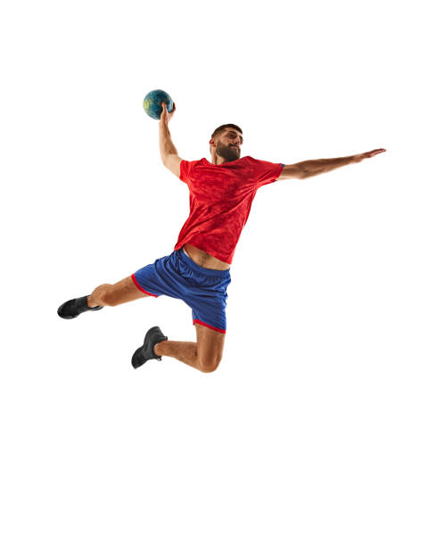 istock Focused and competitive young man, handball player in motion with ball during intense game, throwing all isolated on white background 2177255379