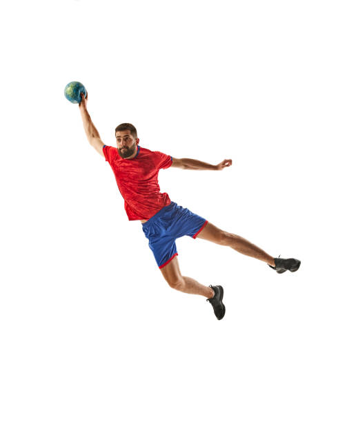 istock Full-length dynamic image of competitive young man, handball player in motion, playing with focus isolated on white background 2177255385