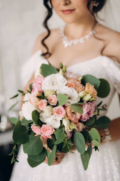 istock black-haired bride girl getting ready for groom in boudoir 2177257135