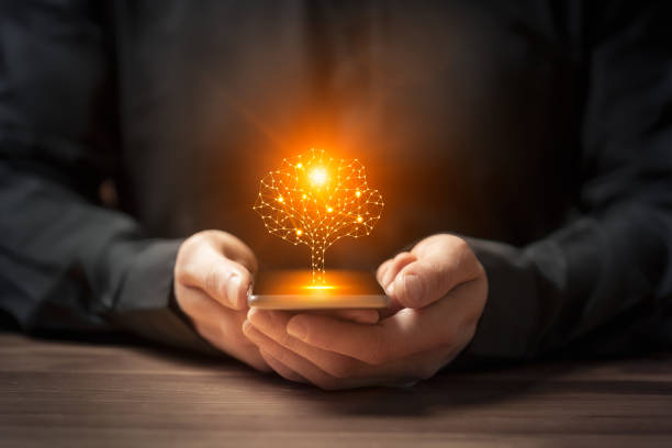 istock Artificial intelligence tree symbol on smartphone in the hands of a man 2177261568