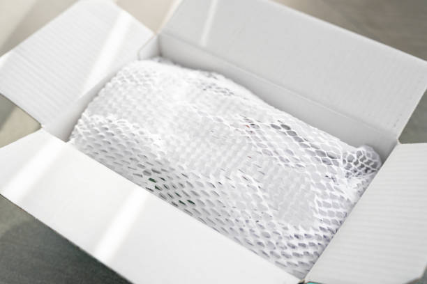 istock Corrugated white paper for safe transportation, in which the goods brought by the courier delivery service are wrapped, environmental packaging concept 2177262807