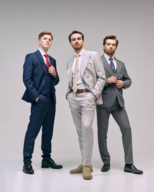 istock Young men standing with casual confidence, emphasizing leadership and teamwork in professional atmosphere against white studio background. 2177264803