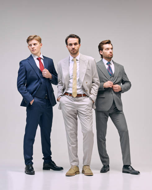 istock Young men standing with casual confidence, emphasizing leadership and teamwork in professional atmosphere against white studio background. 2177264816